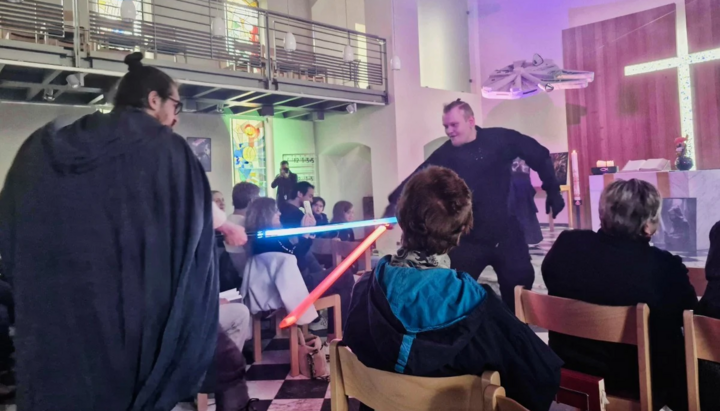 Pastor Samuel Dorr “armed” with a lightsaber. Photo: DPA