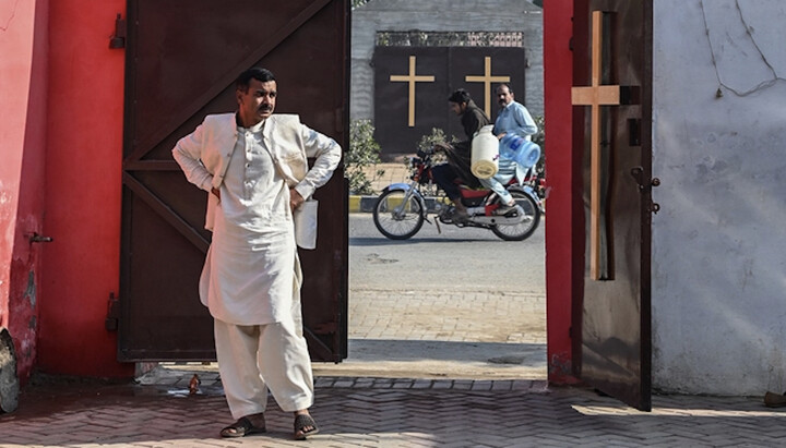A Pakistani at the entrance of a Presbyterian church in Punjab Province. Photo: christianpost.com