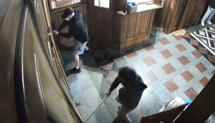 OCU militants "taking" the church cash in the seized cathedral. Photo: UOJ