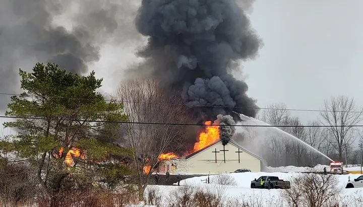 Firefighters battle flames at Abundant Life Fellowship church in Boonville, New York. Photo: Nicole Moore, Daily Sentinel/Boonville Herald via AP