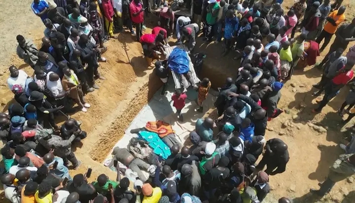 Families burying in a mass grave their relatives killed in deadly attacks by armed groups in Nigeria's central Plateau State. Photo: KIM MASARA/AFPTV/AFP via Getty Images